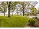 Extensive backyard features mature trees, shed and detached garage, ideal for recreation and outdoor activities at 5861 S 100 W, Fountaintown, IN 46130