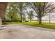 A backyard featuring large trees with a large patio at 5861 S 100 W, Fountaintown, IN 46130