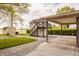 Backyard featuring a shed, secondary suite, and a carport at 5861 S 100 W, Fountaintown, IN 46130