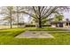 An exterior shot of a shed and suite in a yard with green grass at 5861 S 100 W, Fountaintown, IN 46130