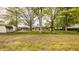 This spacious backyard provides plenty of room for outdoor enjoyment, with mature trees and a detached garage at 5861 S 100 W, Fountaintown, IN 46130