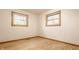 Bedroom featuring hardwood floors and natural light from two windows at 5861 S 100 W, Fountaintown, IN 46130