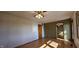 The bright bedroom has wooden floors, natural light, and two entry door options at 5861 S 100 W, Fountaintown, IN 46130
