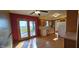 This light-filled dining area has wood floors and direct access to the outside through glass panel doors at 5861 S 100 W, Fountaintown, IN 46130