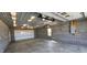 An interior shot of the garage shows concrete flooring, lighting and an electrical panel at 5861 S 100 W, Fountaintown, IN 46130