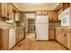 Charming eat-in kitchen features wood cabinets and stainless steel dishwasher at 5861 S 100 W, Fountaintown, IN 46130