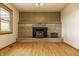 Bright living room offering a brick fireplace and lots of natural light at 5861 S 100 W, Fountaintown, IN 46130