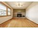 Spacious living room features a charming fireplace and plenty of natural light at 5861 S 100 W, Fountaintown, IN 46130