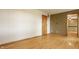 Spacious living room with hardwood floors and a nearby entry door at 5861 S 100 W, Fountaintown, IN 46130