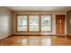Hardwood floors and multiple large windows illuminate the home at 5861 S 100 W, Fountaintown, IN 46130