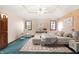 Comfortable bedroom featuring a tray ceiling, neutral paint, and plush carpet at 6640 Greenridge Dr, Indianapolis, IN 46278
