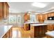 Spacious kitchen with wood cabinets, hardwood floors, and modern appliances at 6640 Greenridge Dr, Indianapolis, IN 46278