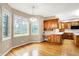Eat-in kitchen nook with hardwood floors, large windows, and view to the yard at 6640 Greenridge Dr, Indianapolis, IN 46278