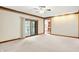Living room with sliding glass door to deck, neutral carpet and views of kitchen at 6640 Greenridge Dr, Indianapolis, IN 46278