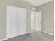 Comfortable bedroom featuring a closet with bi-fold doors, offering ample storage space in a cozy and inviting setting at 18415 Depoe Ln, Westfield, IN 46074