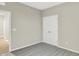 This bedroom features neutral paint, carpet, a double-door closet, and entry to another room at 18415 Depoe Ln, Westfield, IN 46074