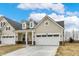 Charming exterior view showcasing the well-maintained lawn and inviting facade of this delightful residential property at 18415 Depoe Ln, Westfield, IN 46074