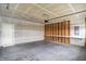 Spacious garage with exposed studs, an overhead door, and a concrete floor at 18415 Depoe Ln, Westfield, IN 46074