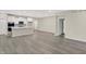 Open-concept layout with a view from the living area to the modern kitchen and dining space at 18415 Depoe Ln, Westfield, IN 46074