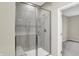 Contemporary shower with glass door, tiled walls and a built-in bench at 18415 Depoe Ln, Westfield, IN 46074