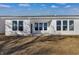 The back yard features a covered patio and a spacious yard with fresh dirt at 251 Hunters Ridge Dr, Danville, IN 46122