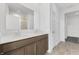 Modern bathroom with double vanity, white countertops and tile flooring at 251 Hunters Ridge Dr, Danville, IN 46122