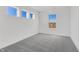 This bedroom features plush gray carpet, white walls and trim, and several windows for plenty of natural light at 251 Hunters Ridge Dr, Danville, IN 46122