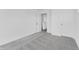 This bedroom features plush gray carpet and white walls with a door to the hallway and a closet at 251 Hunters Ridge Dr, Danville, IN 46122