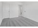 This bedroom features plush gray carpet and white walls with doors to the hallway and a closet at 251 Hunters Ridge Dr, Danville, IN 46122