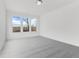 Cozy bedroom with carpet and natural light from three large windows at 251 Hunters Ridge Dr, Danville, IN 46122