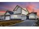A shot of the exterior elevation of the house in the evening at 251 Hunters Ridge Dr, Danville, IN 46122