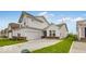 A beautiful, well-maintained two-story home with a spacious driveway, attached garage and pristine lawn at 251 Hunters Ridge Dr, Danville, IN 46122