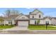 Charming two-story home featuring a brick facade, manicured lawn, and attached two-car garage at 251 Hunters Ridge Dr, Danville, IN 46122