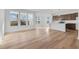 Open-concept space with luxury vinyl floors, white walls and dark cabinetry with stainless appliances at 251 Hunters Ridge Dr, Danville, IN 46122