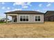 Back exterior features a covered patio and nice vinyl siding at 5005 Carmine St, Brownsburg, IN 46112