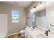 Clean bathroom with single vanity, shower/tub combo, and window at 5005 Carmine St, Brownsburg, IN 46112