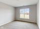 Spacious bedroom with carpet flooring and a large window at 5005 Carmine St, Brownsburg, IN 46112