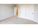 Simple bedroom with carpet flooring and sliding closet doors at 5005 Carmine St, Brownsburg, IN 46112