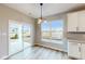 Charming breakfast nook with sliding glass doors and window views at 5005 Carmine St, Brownsburg, IN 46112