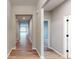 Long hallway with light wood flooring, offering views to other rooms at 5005 Carmine St, Brownsburg, IN 46112