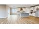 Open concept kitchen with island, stainless steel appliances and white cabinets at 5005 Carmine St, Brownsburg, IN 46112