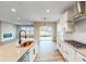 Modern kitchen with a large island, stainless steel appliances and white cabinets at 5005 Carmine St, Brownsburg, IN 46112