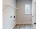 Laundry room with vinyl flooring, shelving, and hookups at 5005 Carmine St, Brownsburg, IN 46112