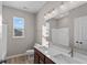 Modern bathroom with double vanity, bathtub, and updated fixtures at 5021 Carmine St, Brownsburg, IN 46112