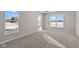 Well-lit bedroom with carpeted floors and multiple windows at 5021 Carmine St, Brownsburg, IN 46112