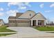Beautiful single-story brick home with a three-car garage and a long driveway at 5021 Carmine St, Brownsburg, IN 46112