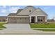 Charming single-story brick home with a three-car garage and a welcoming entrance at 5021 Carmine St, Brownsburg, IN 46112