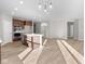 Open concept kitchen with island and hardwood floors at 5021 Carmine St, Brownsburg, IN 46112