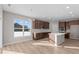 Eat in kitchen with hardwood floors, sliding glass door and island at 5021 Carmine St, Brownsburg, IN 46112