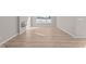 Living area with hardwood floors, fireplace, and large windows at 5021 Carmine St, Brownsburg, IN 46112